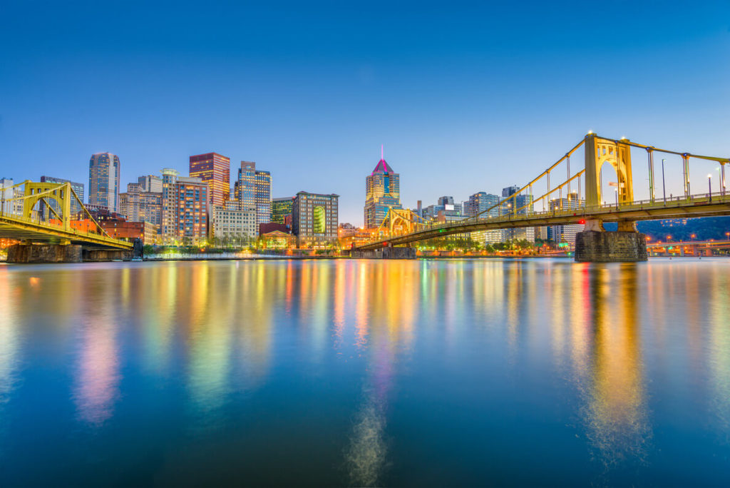 a view of pittsburgh city with a lake on it